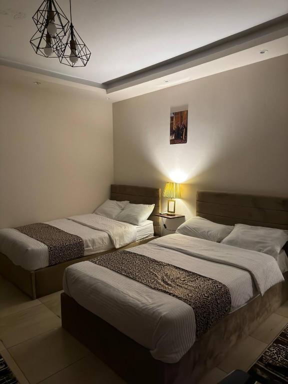 Postel nebo postele na pokoji v ubytování Hur Pyramids Inn