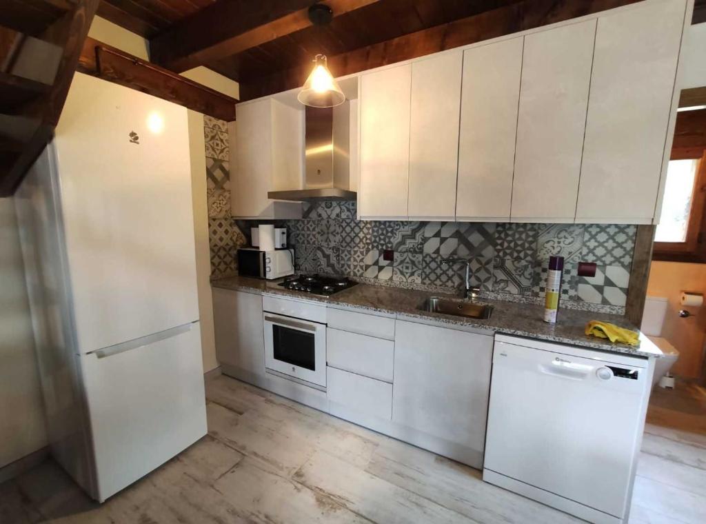 Kuchyň nebo kuchyňský kout v ubytování Borda Batista Casa Rural