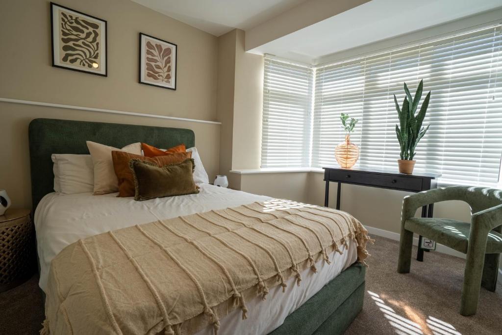 Postel nebo postele na pokoji v ubytování Church Road Retreats - The Reef