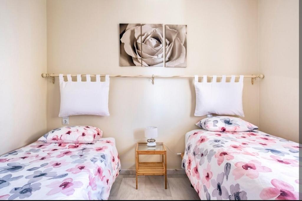 Posteľ alebo postele v izbe v ubytovaní Flamingo Sol Home