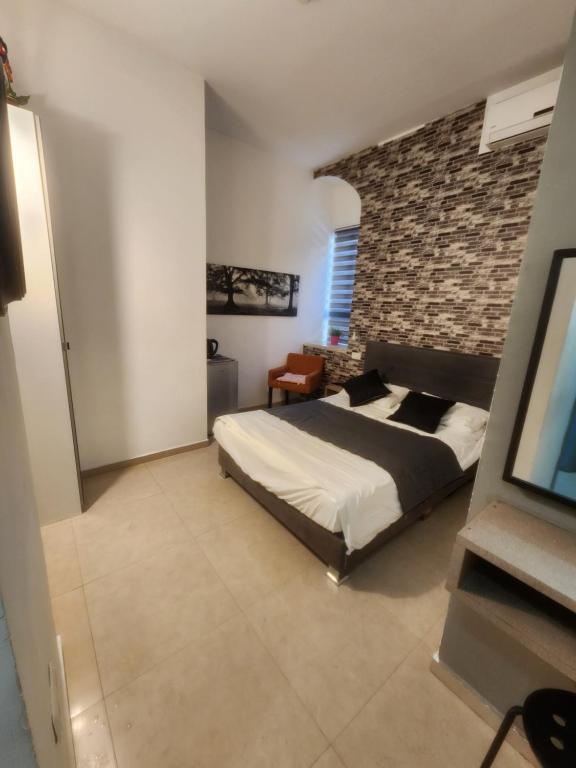 Postel nebo postele na pokoji v ubytování Ben Hillel Boutique Hotel