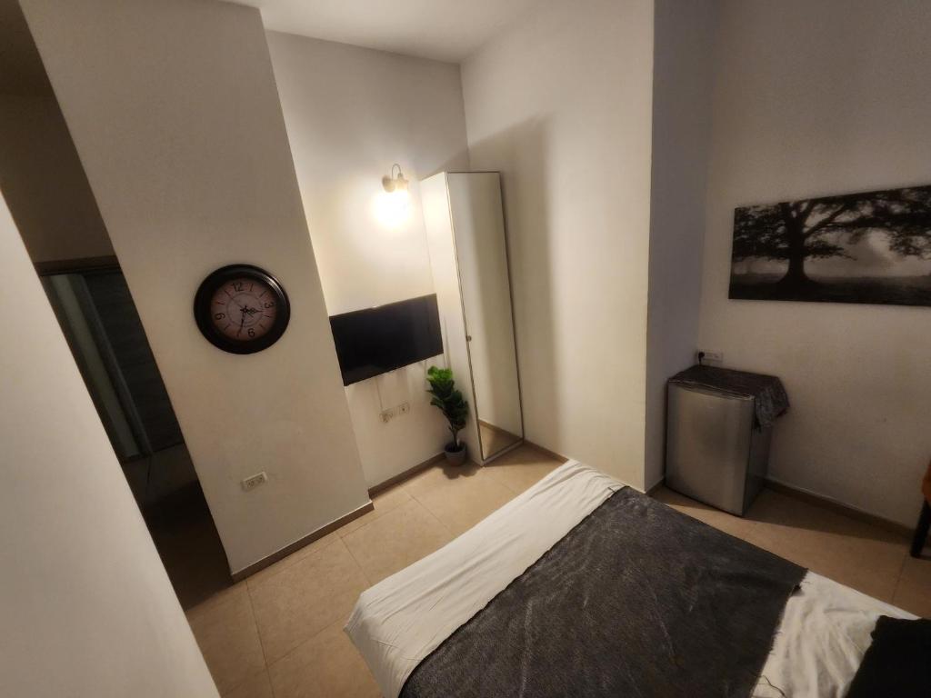 Postel nebo postele na pokoji v ubytování Ben Hillel Boutique Hotel