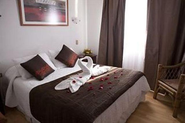 Postel nebo postele na pokoji v ubytování Hotel Real