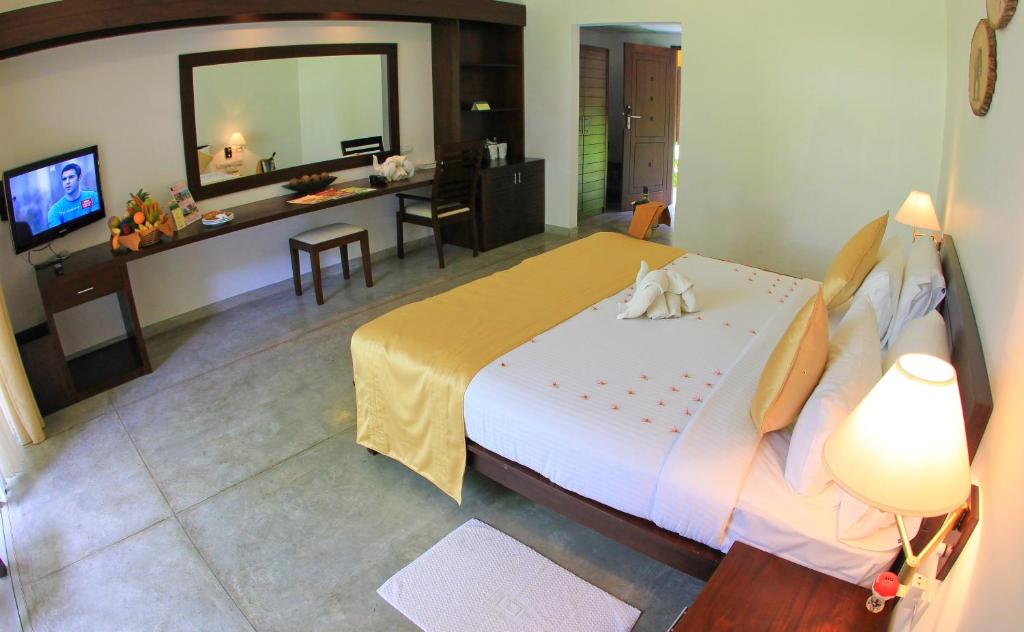 Postel nebo postele na pokoji v ubytování Grand Udawalawe Safari Resort