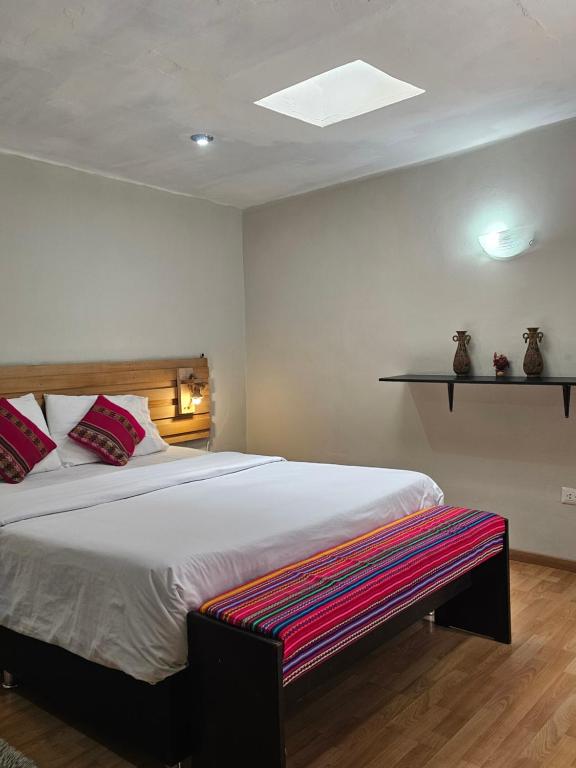 Ένα ή περισσότερα κρεβάτια σε δωμάτιο στο Xplora Hostel Cusco