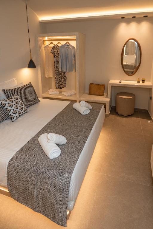 Postel nebo postele na pokoji v ubytování Depalyma Suites