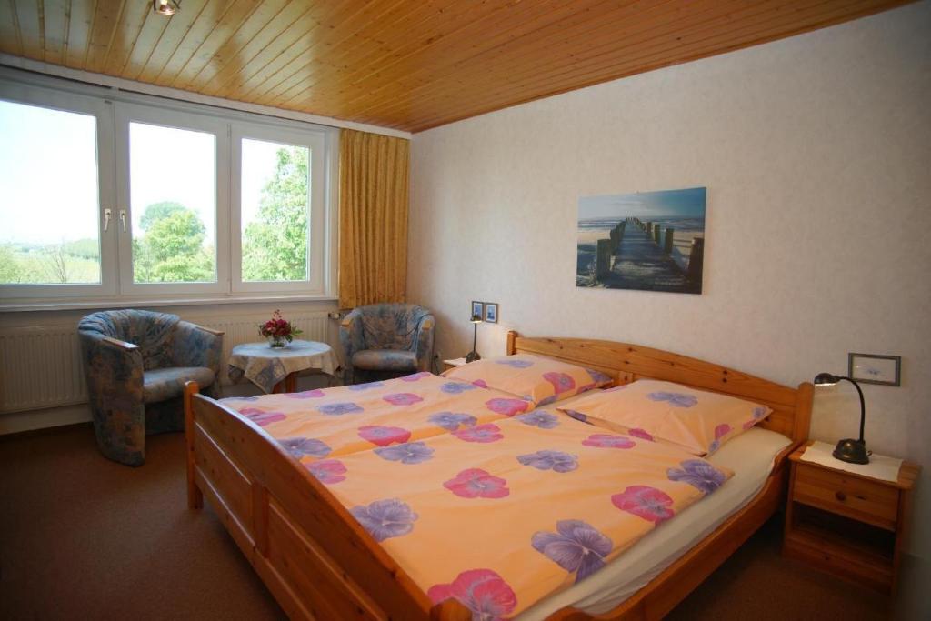 Postel nebo postele na pokoji v ubytování Pension Hansen auf Fehmarn