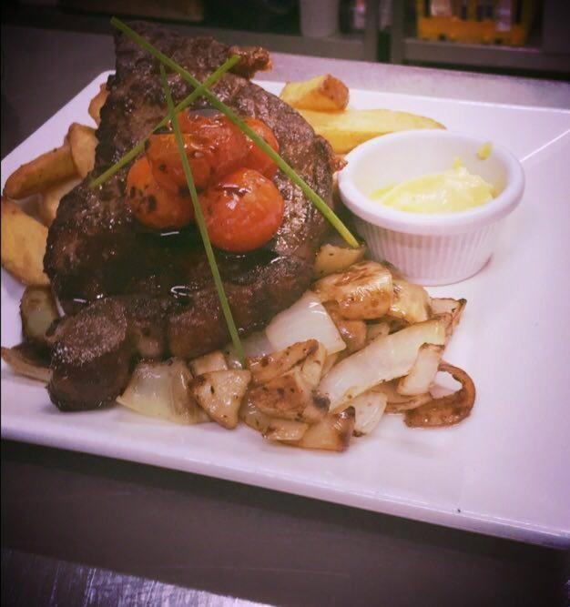 a plate of food with meat and potatoes and sauce at Hatton's of Garadice in Garadice