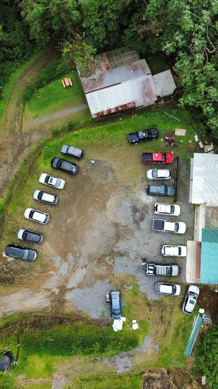 an aerial view of a parking lot with parked cars at Pozas y Cascadas La Presa in Río Cuarto
