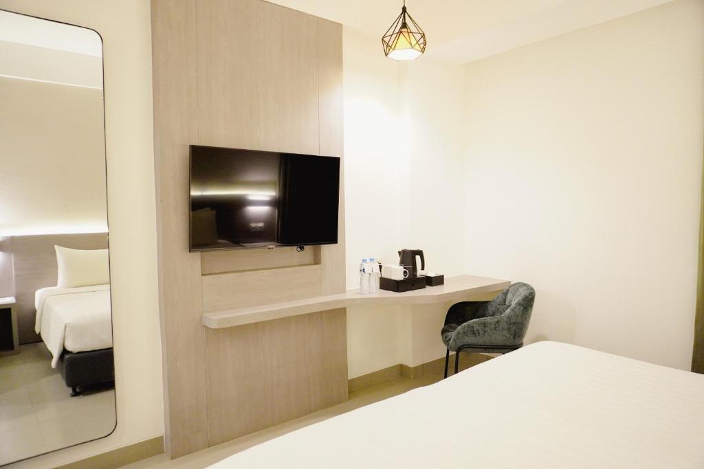 Postel nebo postele na pokoji v ubytování Laska Hotel Subang