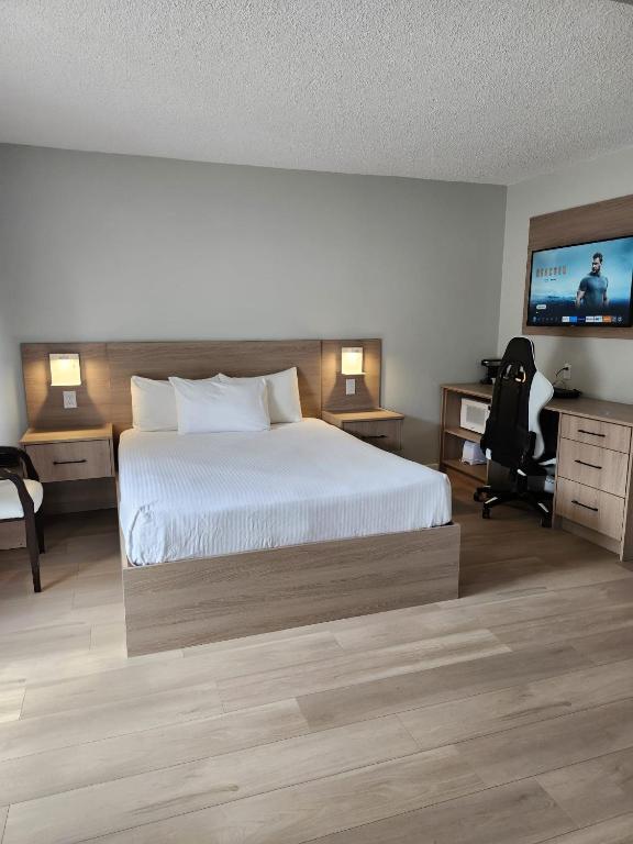 Postel nebo postele na pokoji v ubytování Paradise Motel