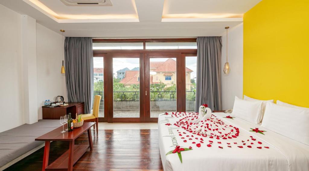 Postel nebo postele na pokoji v ubytování Victoria Central Residence