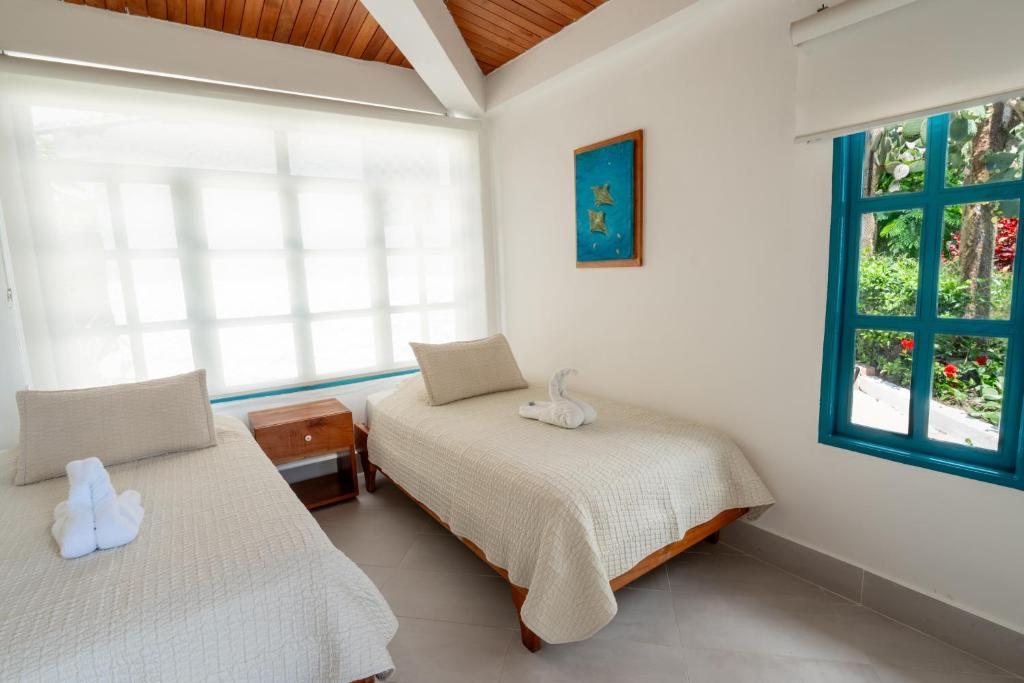 Postel nebo postele na pokoji v ubytování Hotel Fiesta