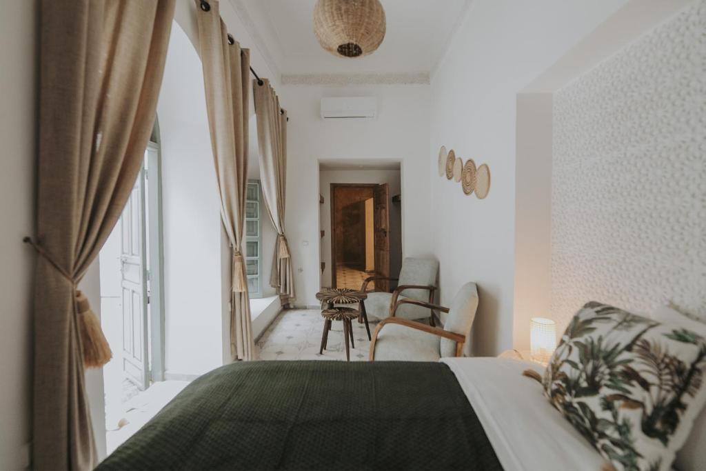 Postel nebo postele na pokoji v ubytování Riad Sierra