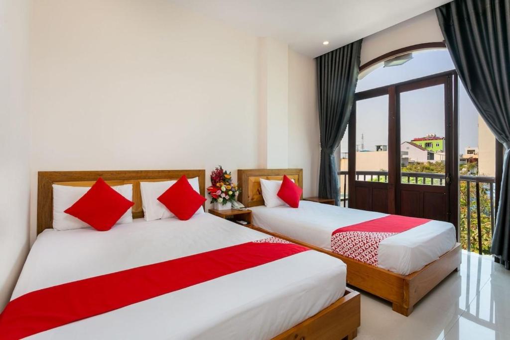 Postel nebo postele na pokoji v ubytování Sunshine Beach Da Nang