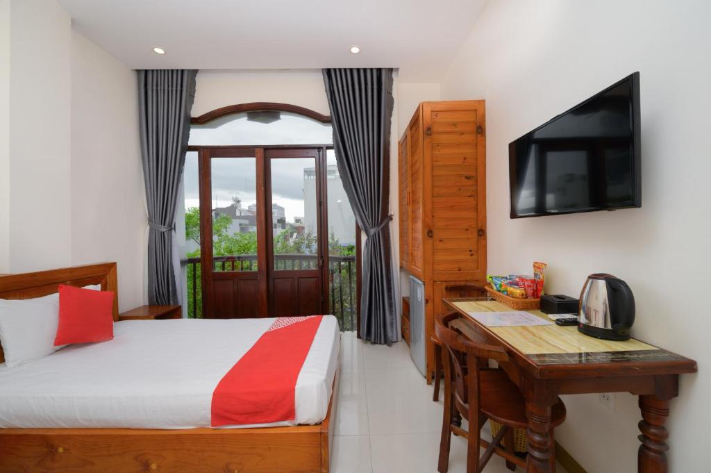 Postel nebo postele na pokoji v ubytování Sunshine Beach Da Nang