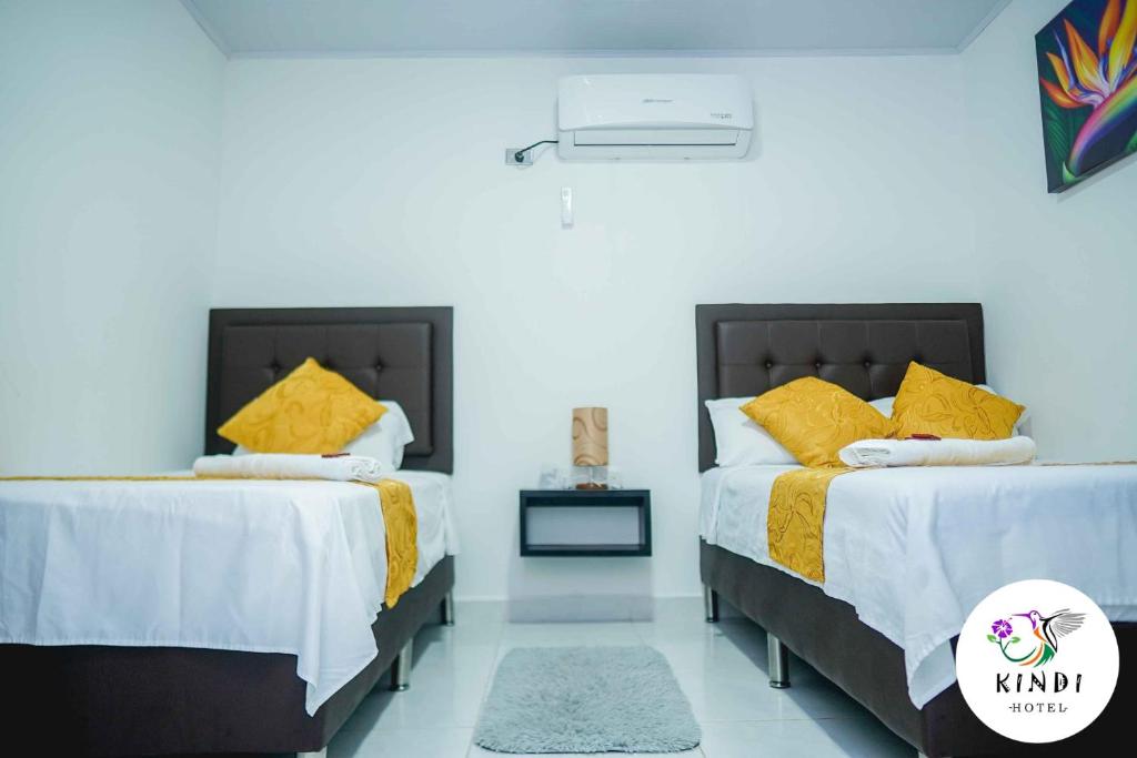Postel nebo postele na pokoji v ubytování HOTEL KINDI Orito