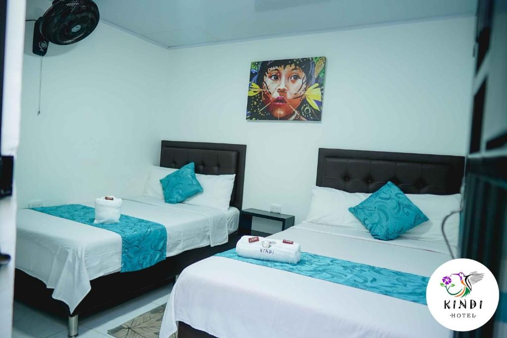 Postel nebo postele na pokoji v ubytování HOTEL KINDI Orito