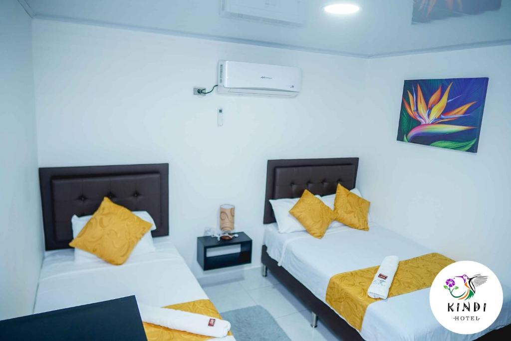 Postel nebo postele na pokoji v ubytování HOTEL KINDI Orito