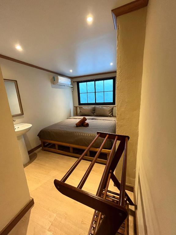 Postel nebo postele na pokoji v ubytování Tian Ming Hostel
