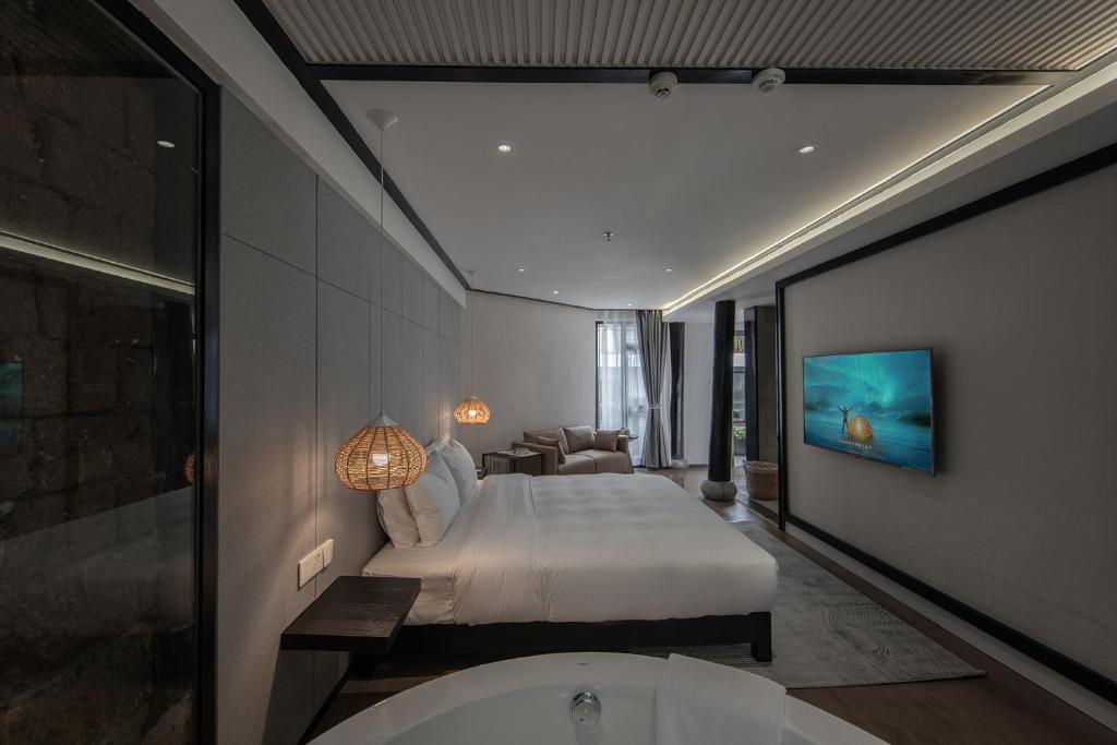 TV a/nebo společenská místnost v ubytování Lijiang Liman Wenzhi No.1 Hotel