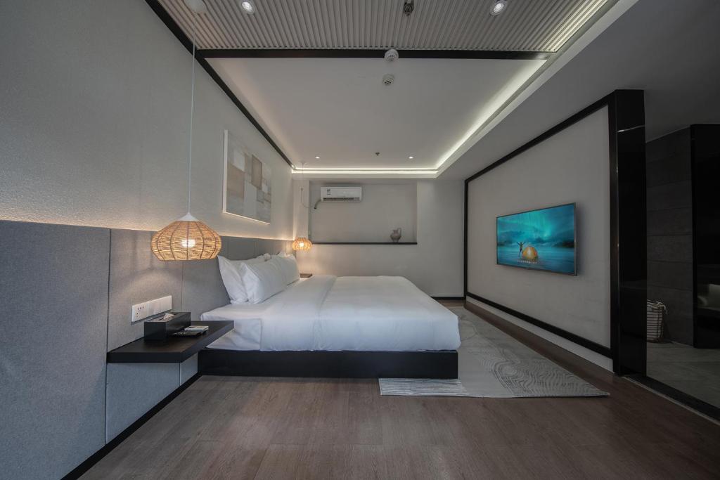 Postel nebo postele na pokoji v ubytování Lijiang Liman Wenzhi No.1 Hotel