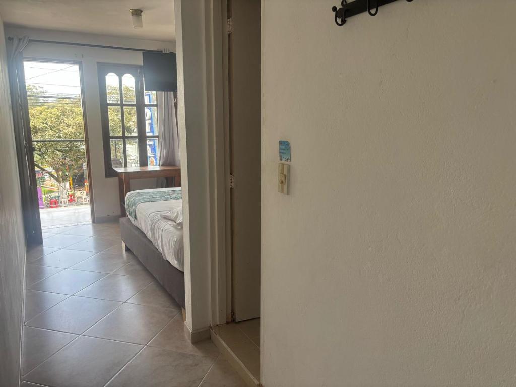 Postel nebo postele na pokoji v ubytování Hotel Portal Guatapé