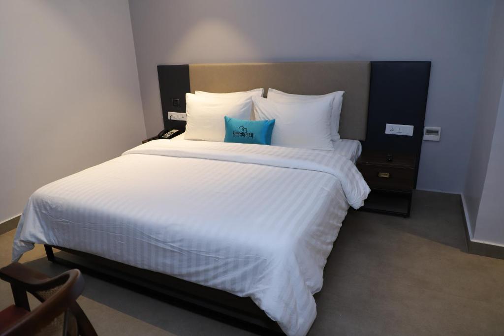 Postel nebo postele na pokoji v ubytování Belvedere Suites