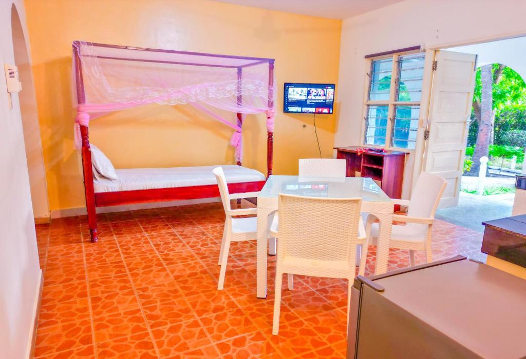 Postel nebo postele na pokoji v ubytování Maasai Resort