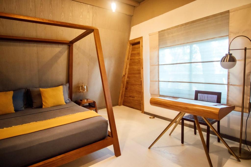 Postel nebo postele na pokoji v ubytování Asmara Urban Resort & Lifestyle Village Powered by ASTON