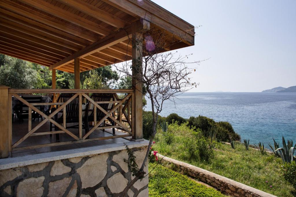 a building with a view of the water at Villa Aktan in Kas