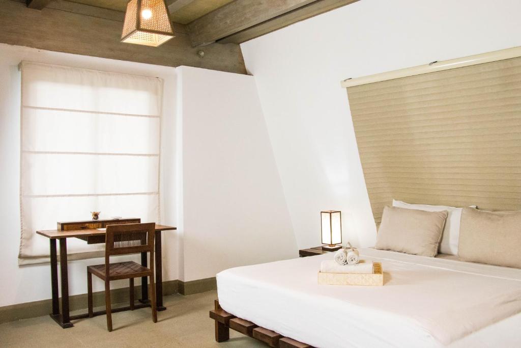 Postel nebo postele na pokoji v ubytování Asmara Urban Resort & Lifestyle Village Powered by ASTON