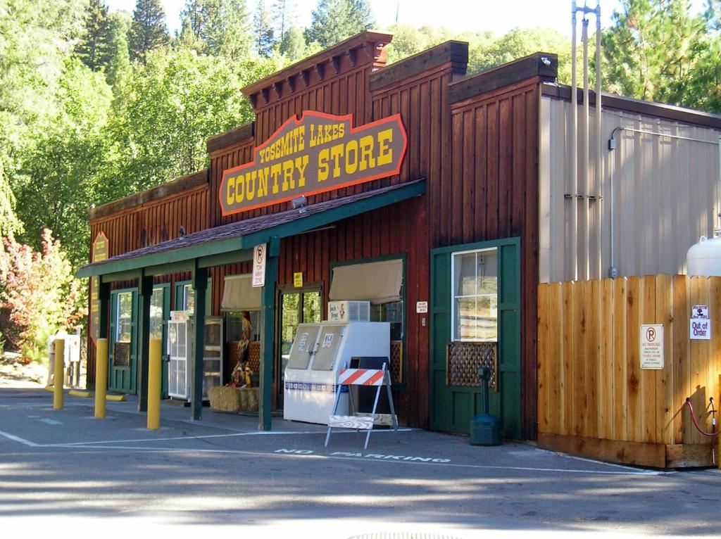 a building with a sign that reads survival store at Yosemite Lakes River Yurt 22 in Harden Flat