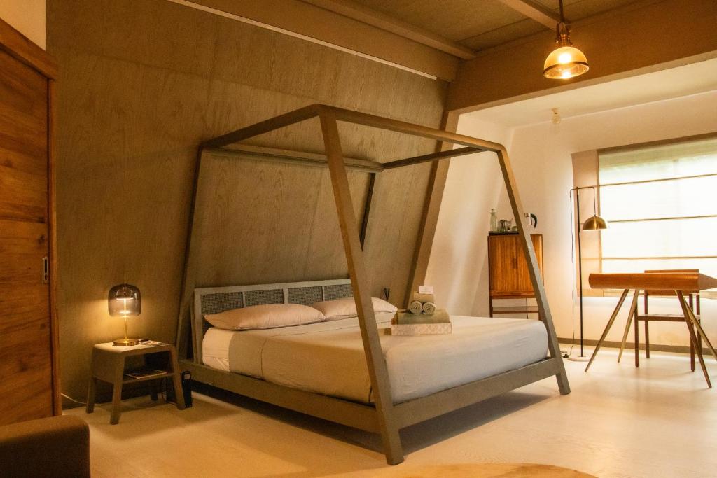 Postel nebo postele na pokoji v ubytování Asmara Urban Resort & Lifestyle Village Powered by ASTON