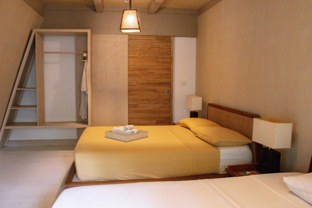 Postel nebo postele na pokoji v ubytování Asmara Urban Resort & Lifestyle Village Powered by ASTON