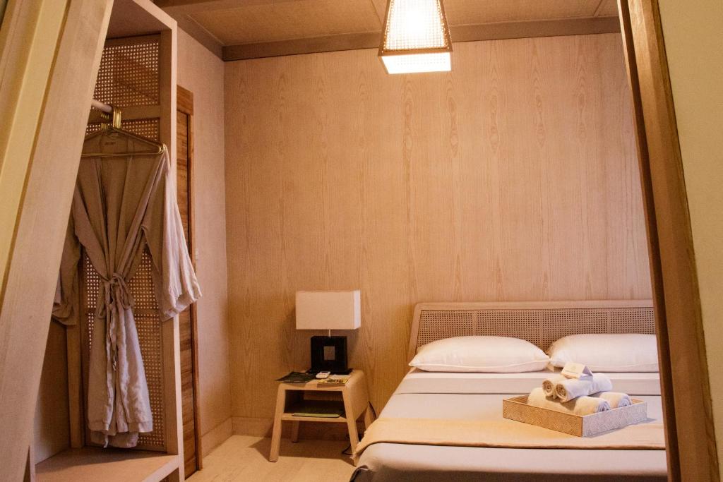 Postel nebo postele na pokoji v ubytování Asmara Urban Resort & Lifestyle Village Powered by ASTON