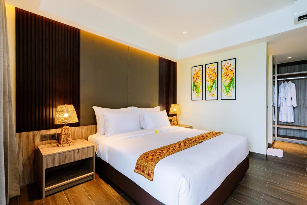 Postel nebo postele na pokoji v ubytování Big Dragon Villas Ubud
