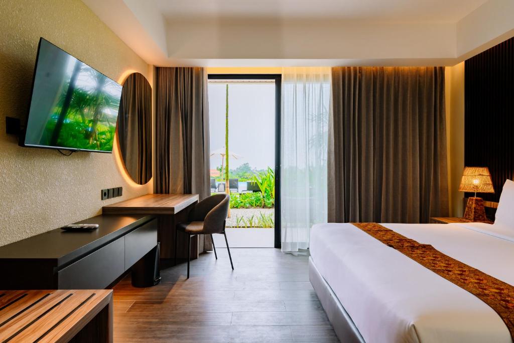 Postel nebo postele na pokoji v ubytování Big Dragon Villas Ubud