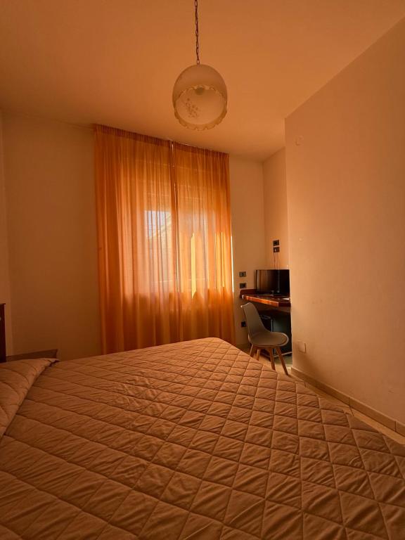 Postel nebo postele na pokoji v ubytování Grifone Hotel