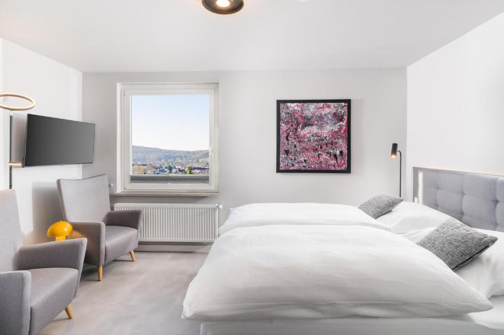 Postel nebo postele na pokoji v ubytování Hotel Görtler
