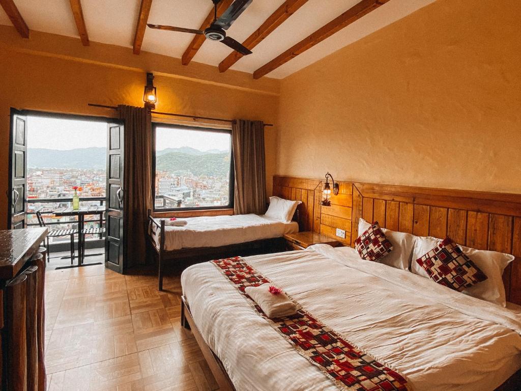 Una cama o camas en una habitación de Hotel Tourist Residency