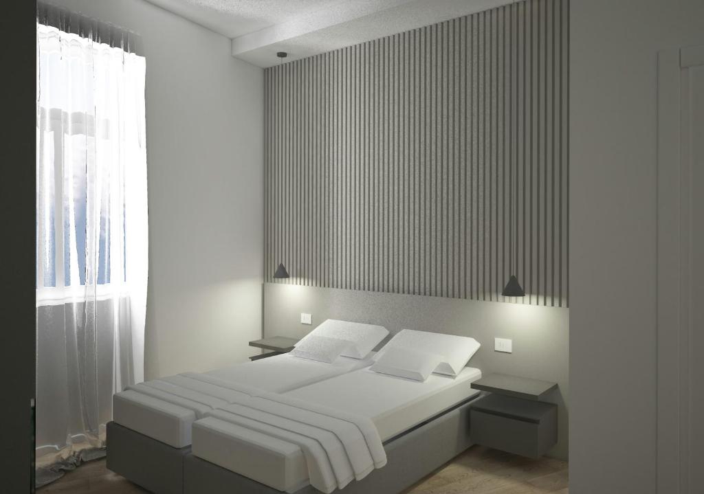 Una cama o camas en una habitación de Boutique Suites Joyce