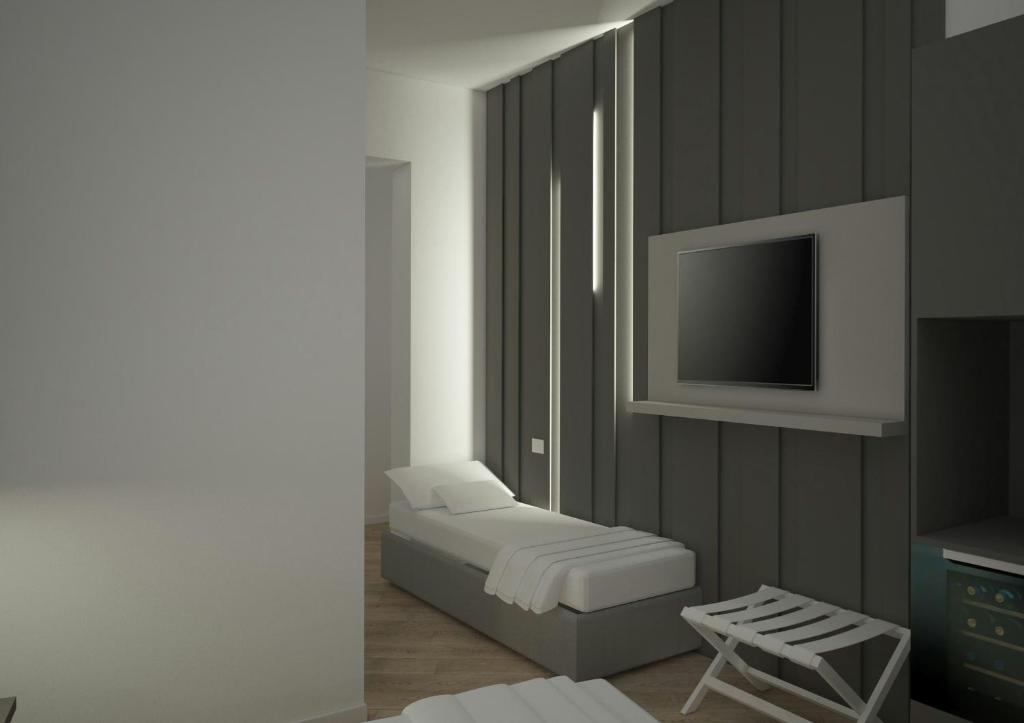 Una televisión o centro de entretenimiento en Boutique Suites Joyce