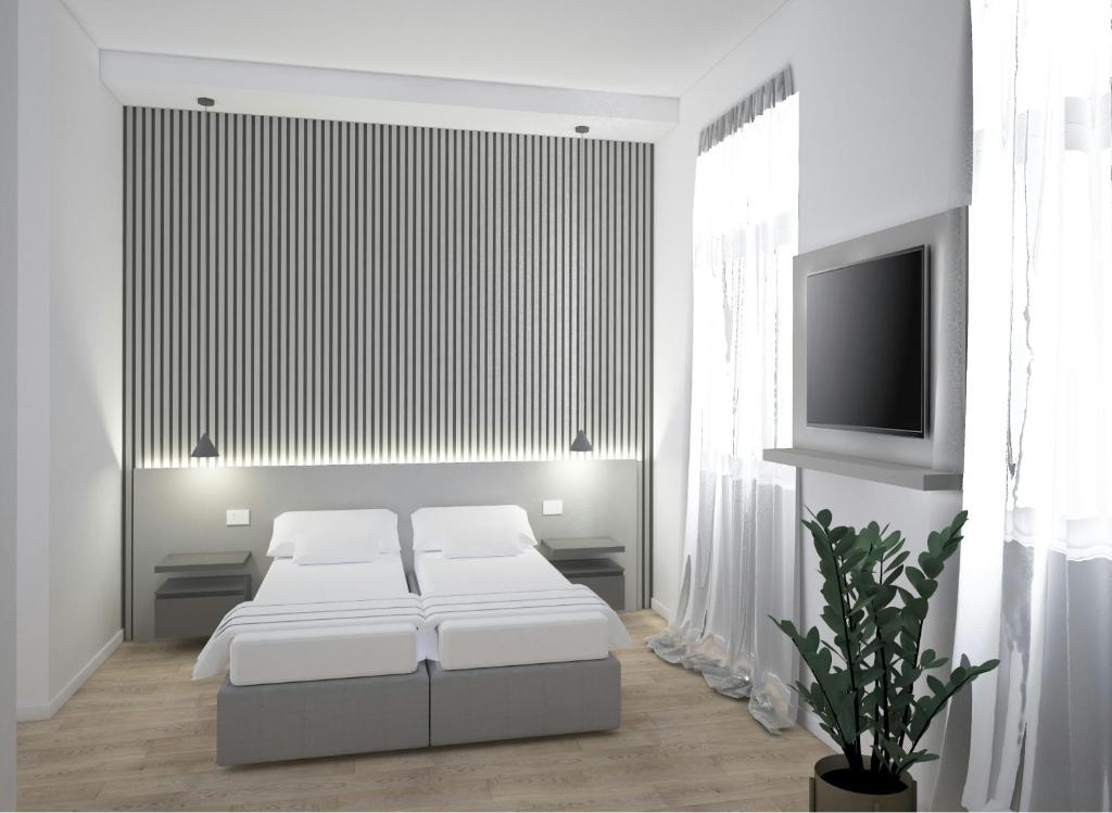 Una cama o camas en una habitación de Boutique Suites Joyce