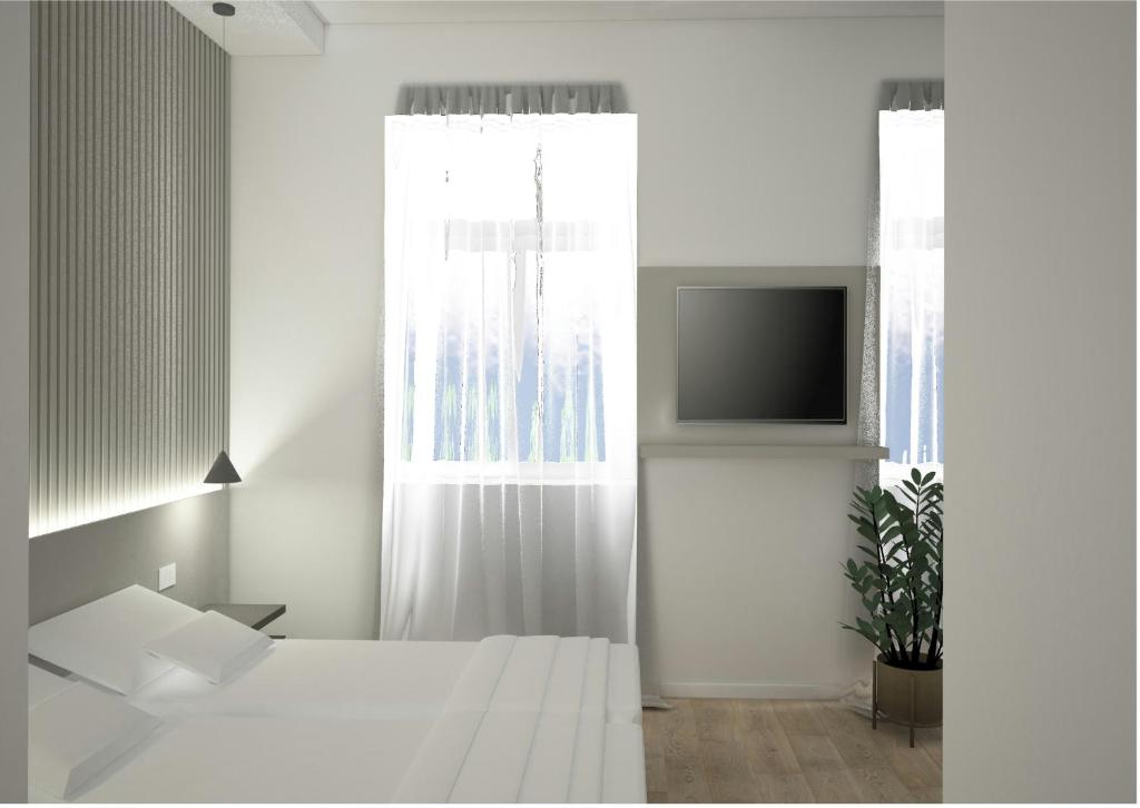 Una cama o camas en una habitación de Boutique Suites Joyce