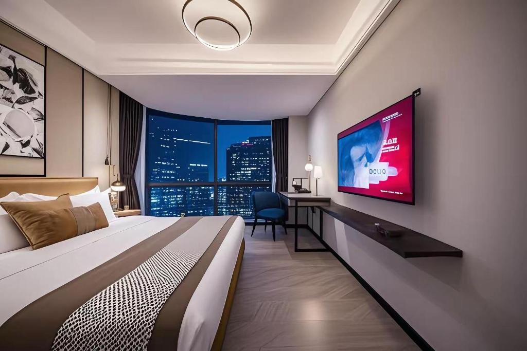 Postel nebo postele na pokoji v ubytování 和樾 City View Hotel - Guangzhou Taikoo Hui Zhujiang New Town Tianhe Sports Cente-Canton Fair
