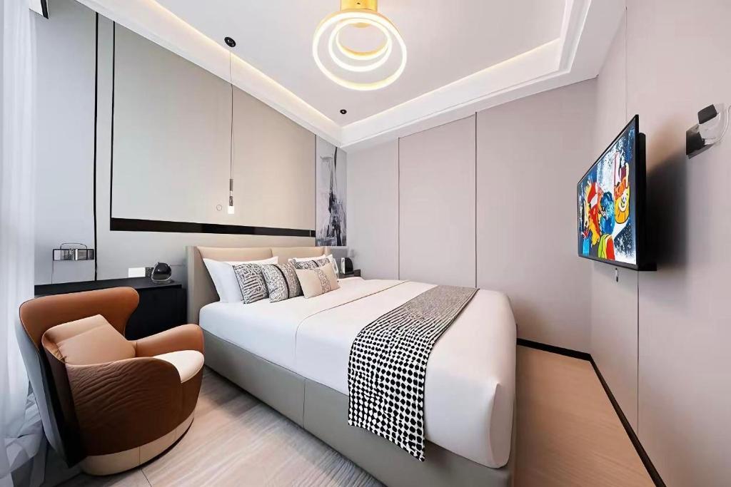 Postel nebo postele na pokoji v ubytování 和樾 City View Hotel - Guangzhou Taikoo Hui Zhujiang New Town Tianhe Sports Cente-Canton Fair