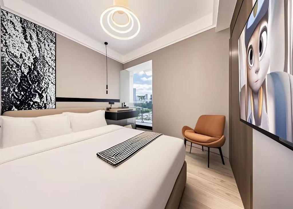 TV a/nebo společenská místnost v ubytování 和樾 City View Hotel - Guangzhou Taikoo Hui Zhujiang New Town Tianhe Sports Cente-Canton Fair