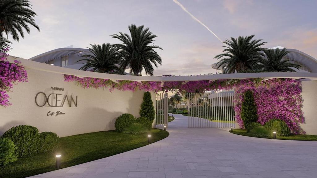 an external view of a building with purple flowers at Ocean Home - Costa Ballena in Costa Ballena