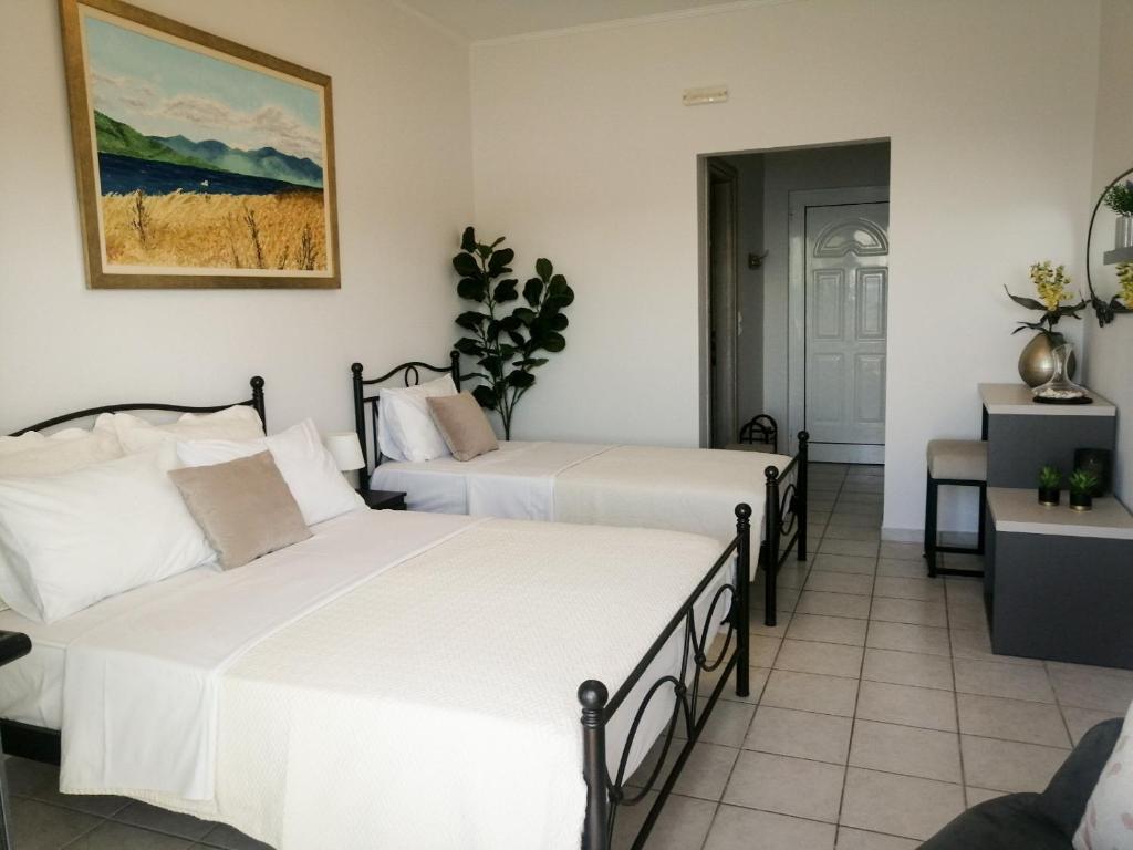 Postel nebo postele na pokoji v ubytování Anel Rooms